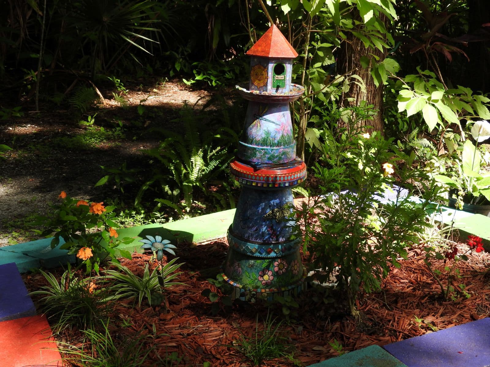 Historic stonework and tropical plants at Dunlawton Sugar Mill Gardens.