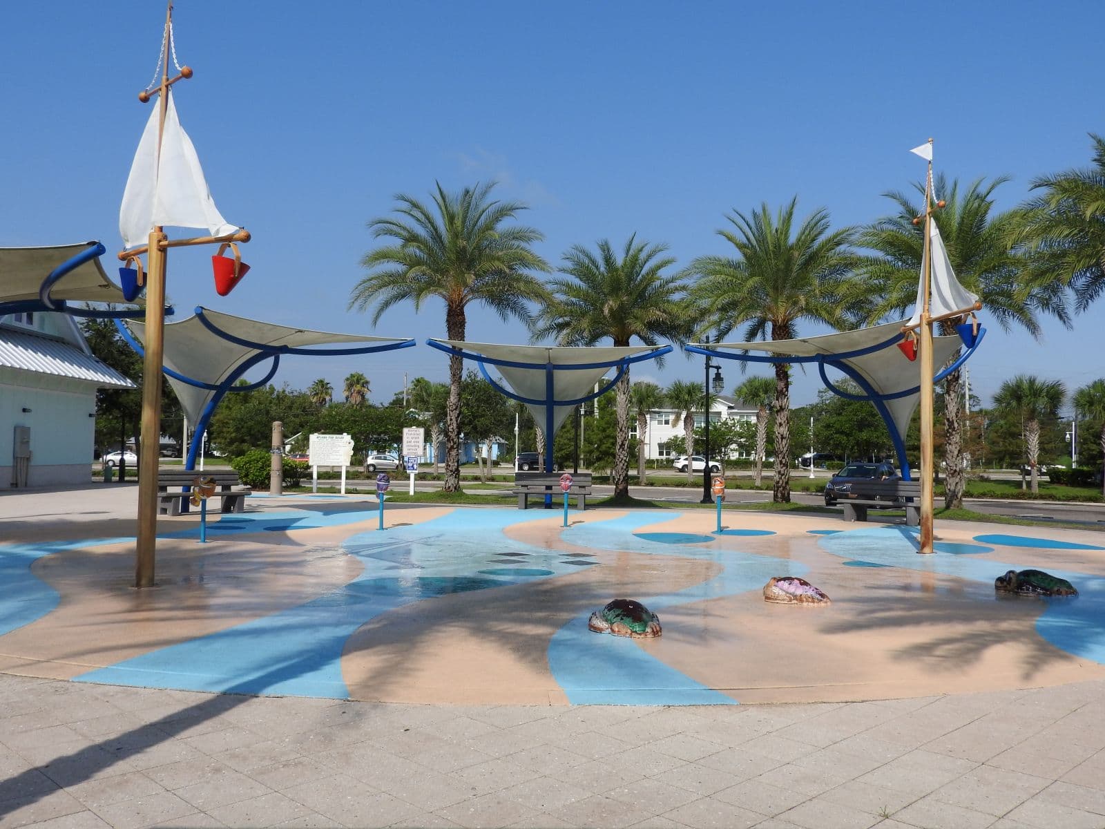 Riverfront promenade and palm trees at Riverwalk Park.