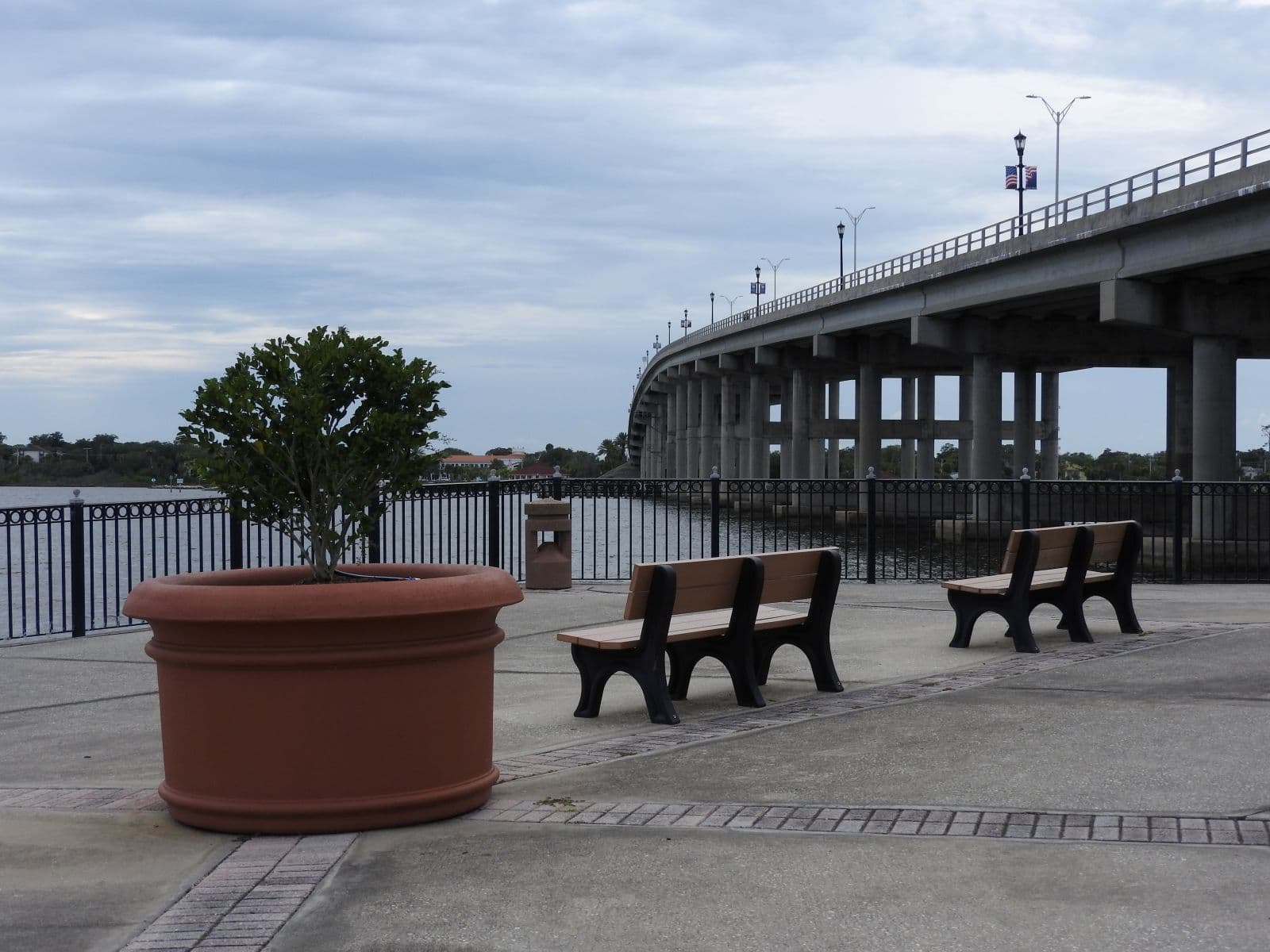 Benches overlooking the Halifax River beside Granada Bridge at Rockefeller Gardens.