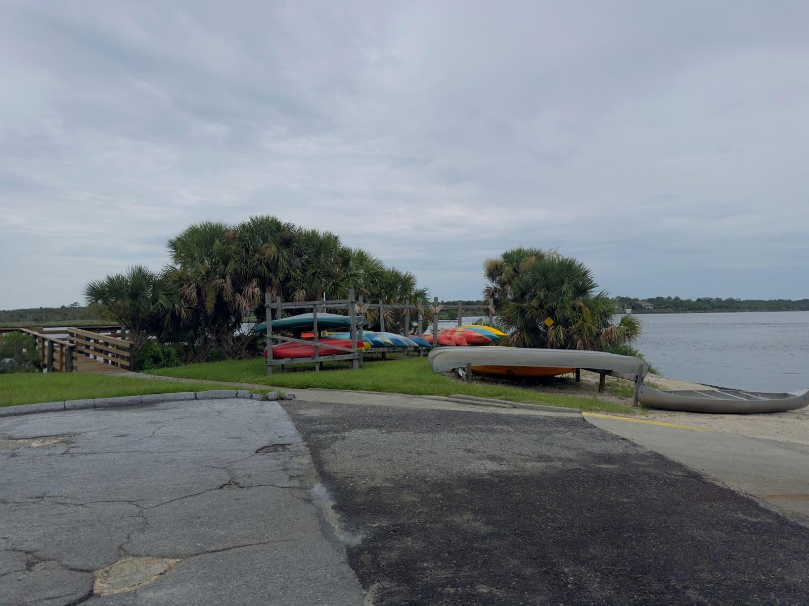 Canoes and kayaks arranged beside a public launch on the Tomoka River.